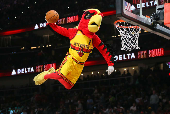 Atlanta Hawks mascot dunks during a timeout.